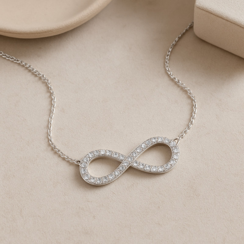 Collier femme CARADOR en or blanc 750/000 et oxydes de zirconium motif infini