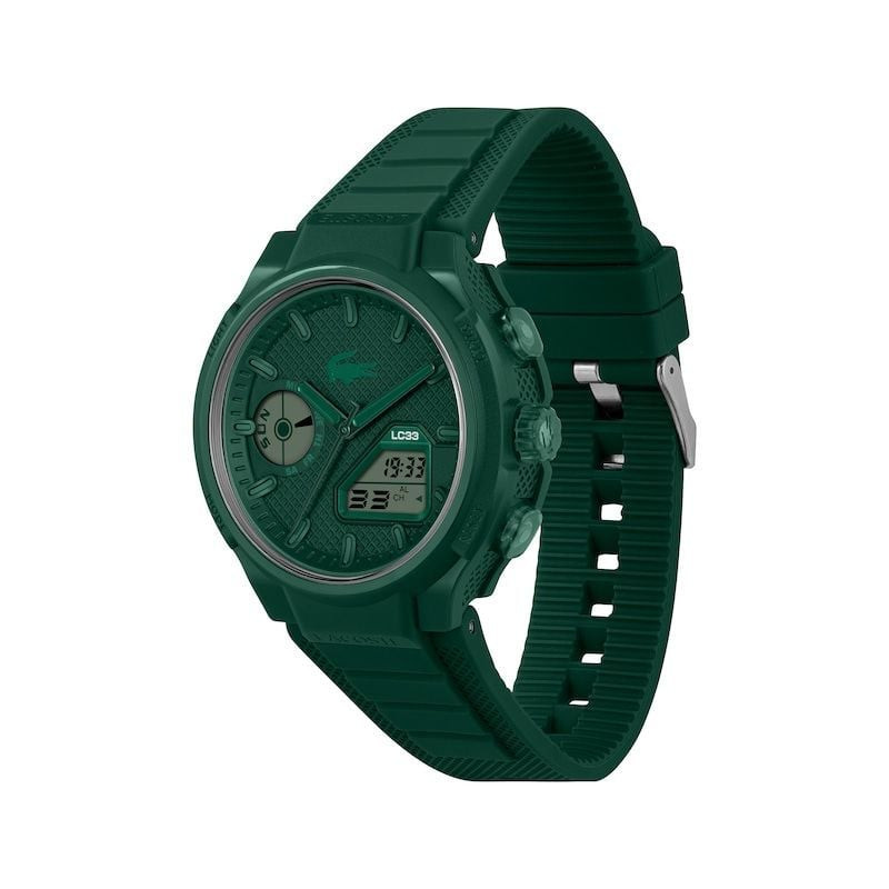 Ambiance lifestyle flatlay de la montre verte LACOSTE LC33 avec accessoires du quotidien