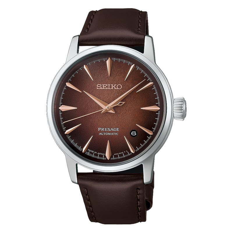 Gros plan sur le cadran de la montre Seiko Presage Whiskey Mist, texture brun dégradé, aiguilles or 