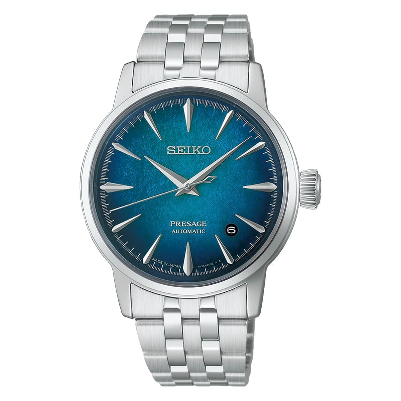 Gros plan sur la montre Seiko Presage Emerald Mist, cadran bleu texturé, aiguilles argentées et guic