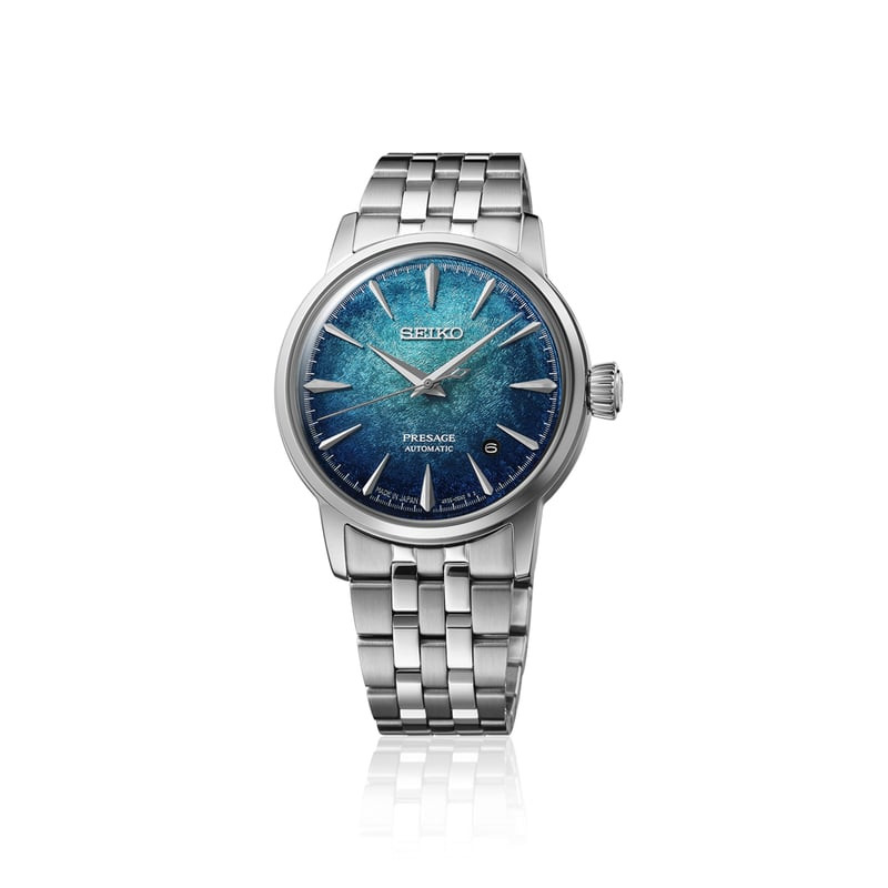 Montre automatique Seiko Presage Emerald Mist sur fond blanc avec reflet, vue complète du boîtier et