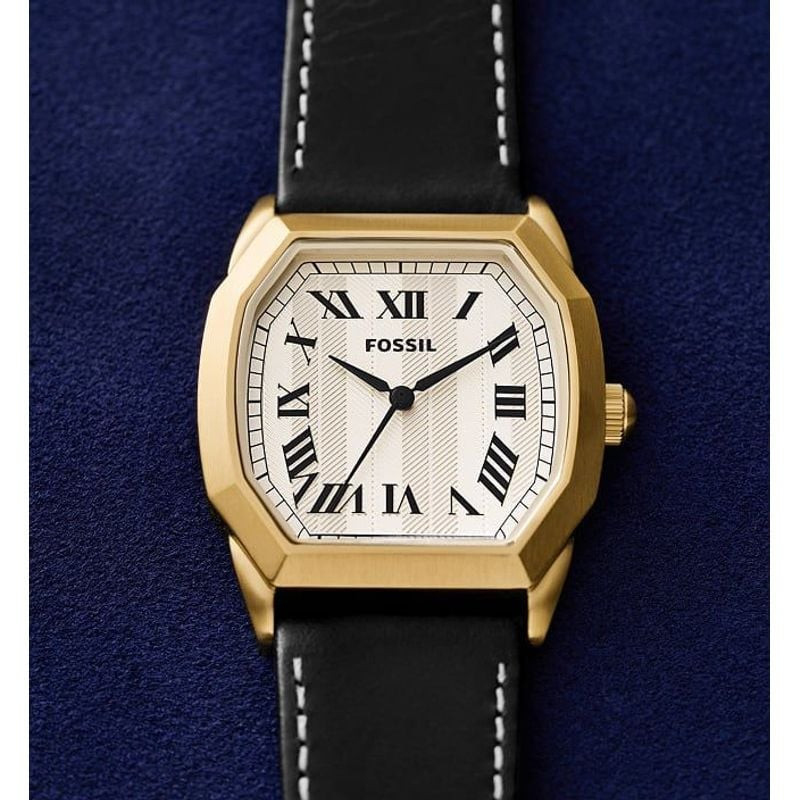 Montre Fossil Harlow FS6215 avec boîtier doré et cadran crème à chiffres romains sur fond bleu textu