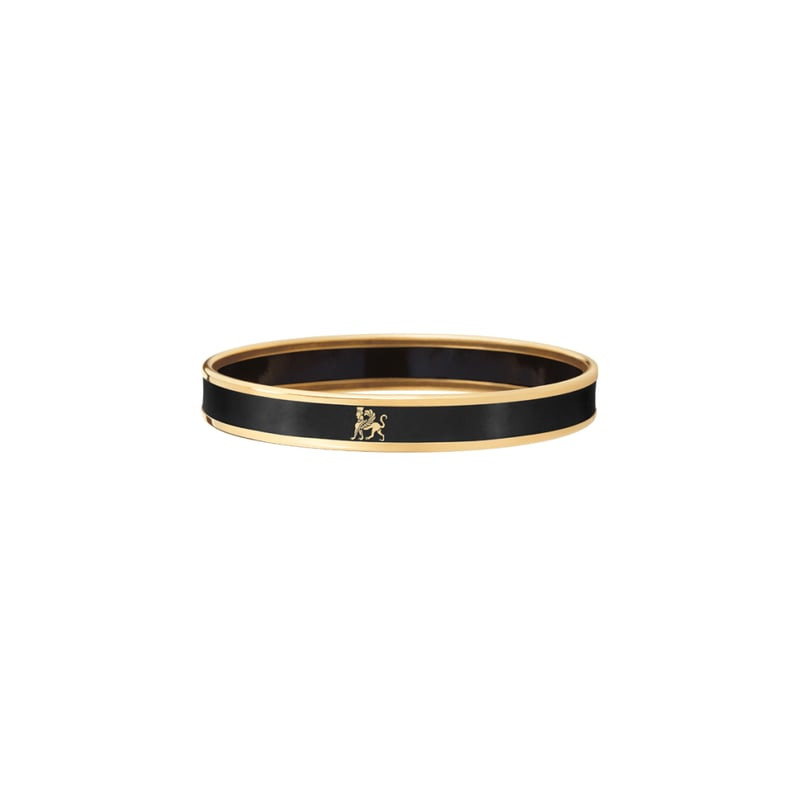 Bracelet jonc FREY WILLE à liseré doré, émail feu noir profond et motif lion doré, présenté en packs