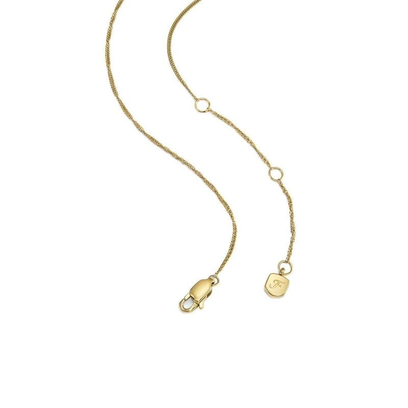 Gros plan sur le pendentif cœur en malachite verte du collier Fossil Modern Meadows en acier doré.