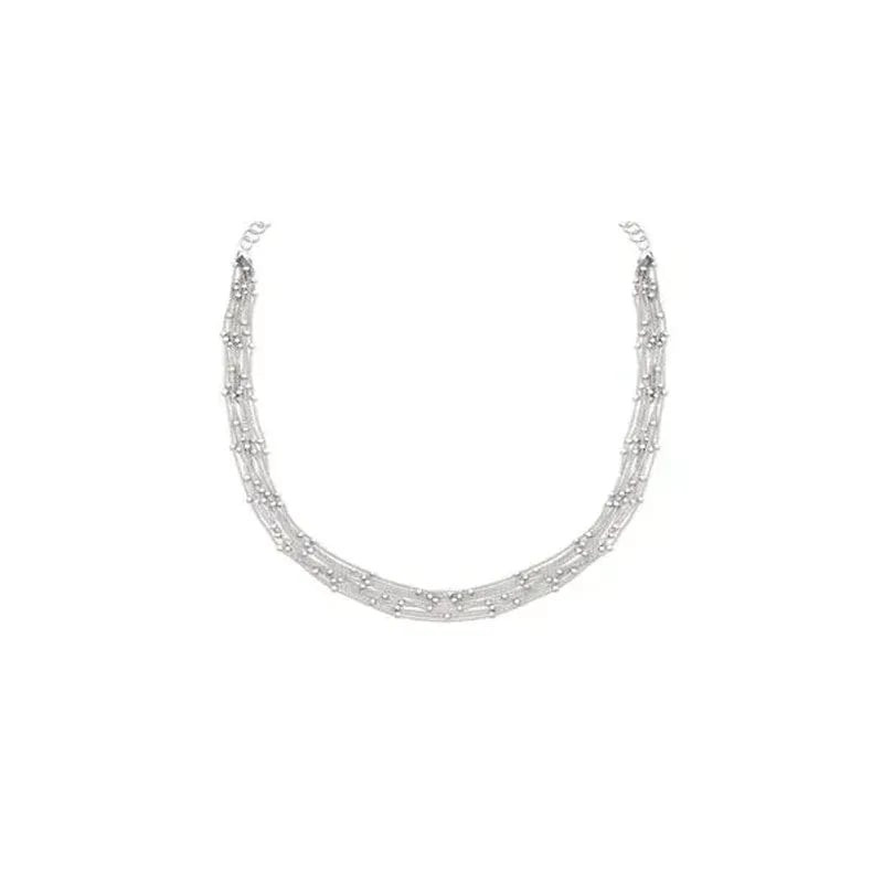 Collier 10 rangs chaîne boules en argent 925 rhodié, courbe en U, fermoir menotte sur fond blanc