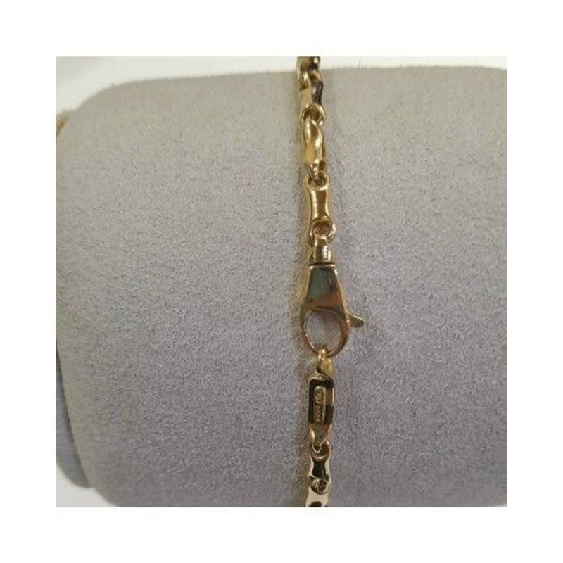 Bracelet maillons CHIMENTO Bamboo Classic doré : détail des maillons bambou et fermoir mousqueton.