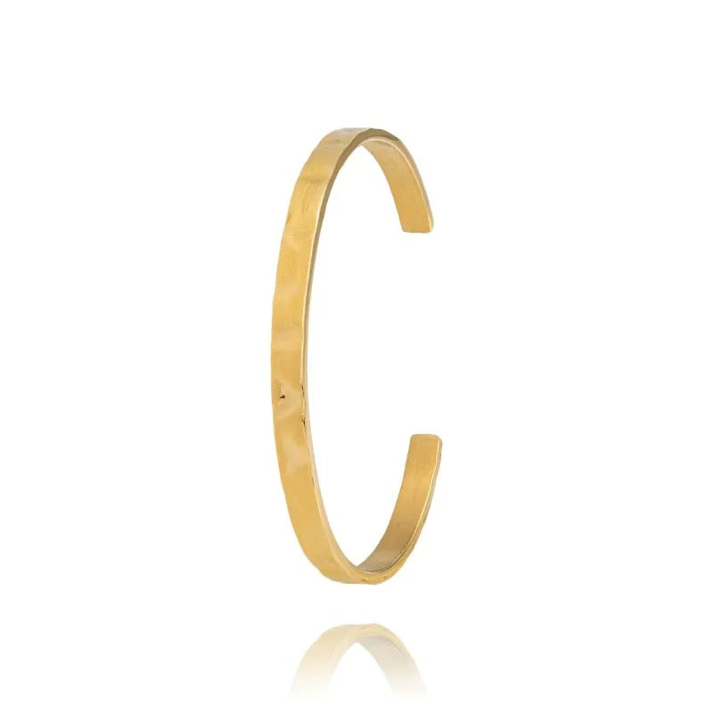 Packshot du bracelet jonc Reflets LOUISE GARDEN en acier doré, fini miroir et design minimaliste.