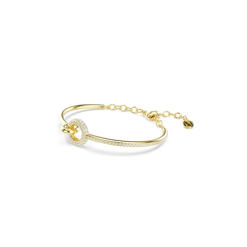 Bracelet jonc Swarovski Dextera doré présenté en angle avec cercle pavé et rallonge de chaîne sur fo