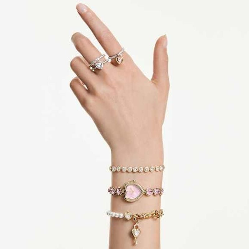 Bracelet tennis SWAROVSKI Una Angelic cristaux blanc doré porté au poignet, éclat doré au quotidien