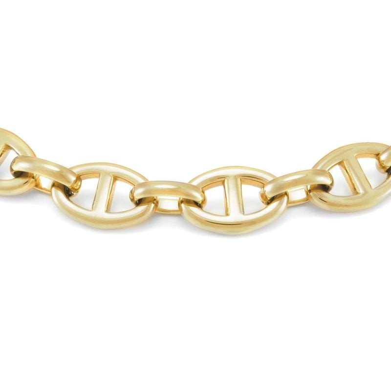Gros plan sur le bracelet chaîne Heritage Fossil en acier doré avec cristaux, montrant les maillons 