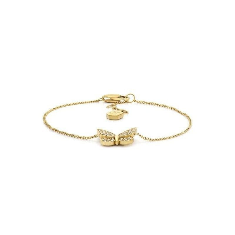 Bracelet chaîne Fossil Sutton papillon acier doré porté au poignet, avec reflets dorés et cristaux s