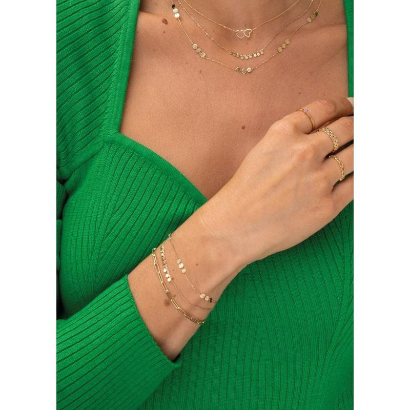 Bracelet cercles West End JACKIE 585 MILLIEMES doré porté au poignet, style élégant et lumineux au q