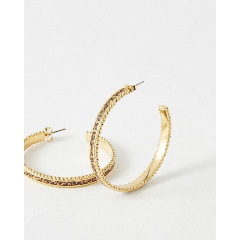 Packshot des Boucles d'Oreilles Créoles FlowersForZoé Léo Cuir Acier Doré