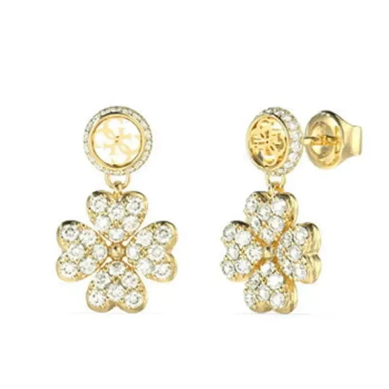Boucles d'oreilles pendantes GUESS Love Bites dorées avec trèfle à quatre feuilles pavé et clous hal