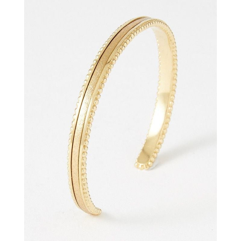 Bracelet jonc rigide doré avec bords perlés et insert en cuir doré métallisé, packshot incliné sur f