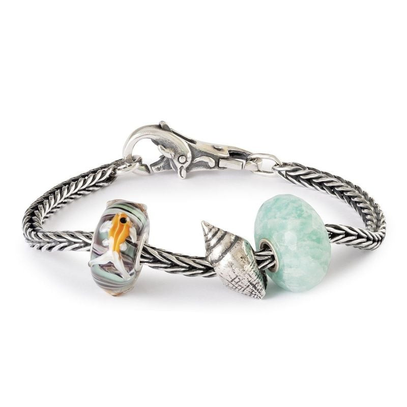 Perle Trollbeads Une Grâce Fluide Verre Violet en verre soufflé et argent 925 aux reflets tourbillon