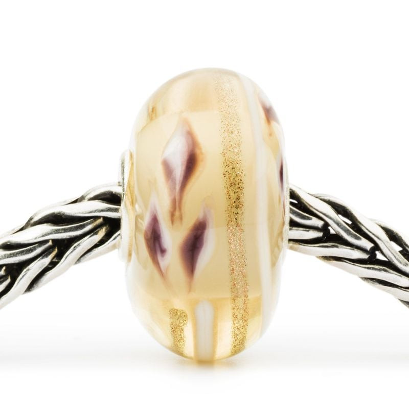 Packshot de la Perle de Verre Trollbeads Sérénité, perle artisanale en verre, symbole de paix intéri