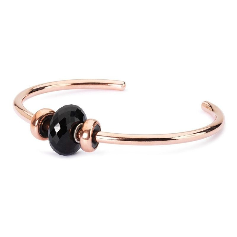 Perle Trollbeads Onyx noir facettée sur jonc ouvert en or rose lisse