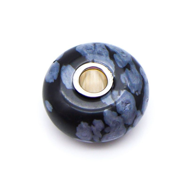 Perle de Charme Trollbeads Flocon Obsidienne Noir, packshot sur fond neutre mettant en valeur la pie