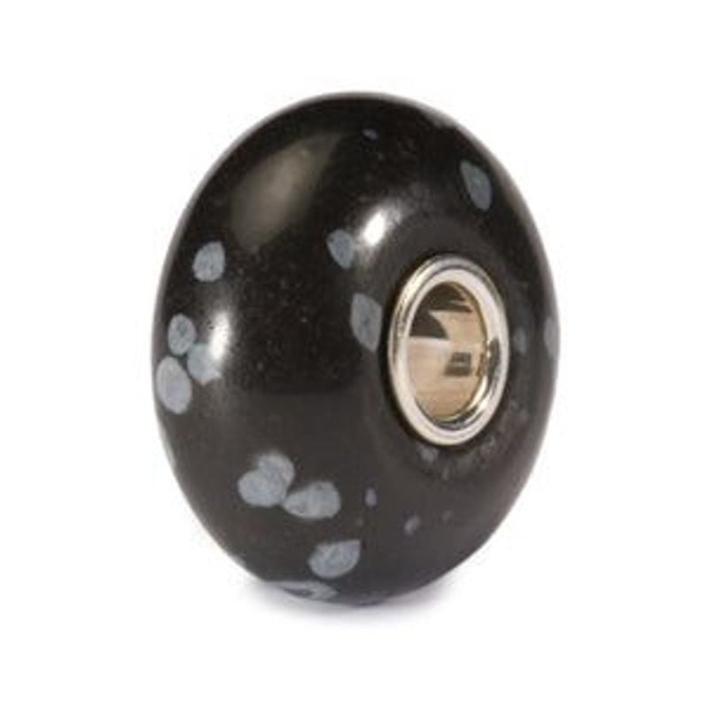 Packshot de la Perle de Charme Trollbeads Flocon Obsidienne Noir sur fond blanc