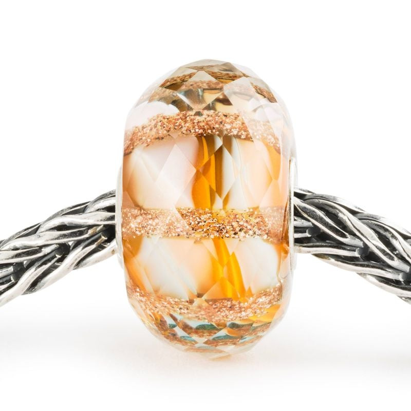 Packshot de la Perle Trollbeads Vitalité Ensoleillée en verre multicolore, un bijou artisanal éclata