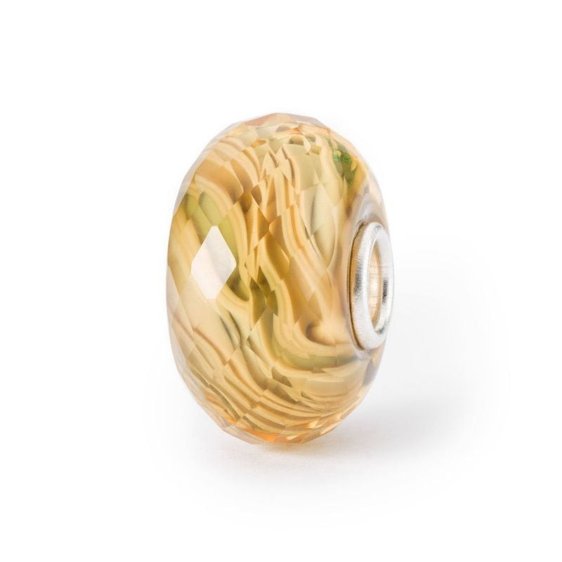 Packshot de Perle Trollbeads Rayons de Soleil Verre Jaune, bijou artisanal en verre jaune.