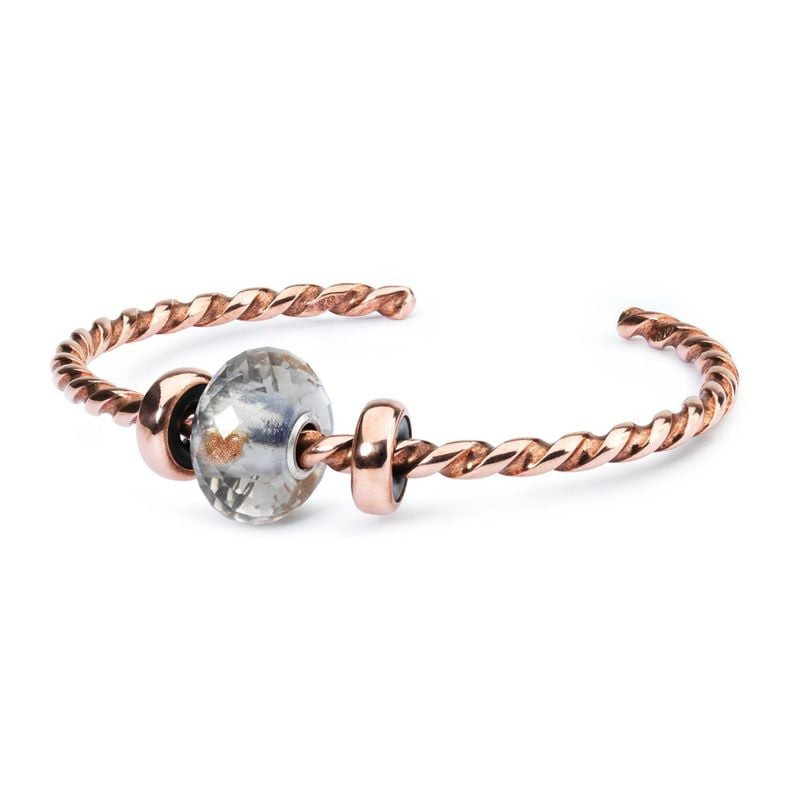 Perle Trollbeads Éclat du Jour Facettée Verre Gris sur fond lumineux, édition limitée en verre de Mu