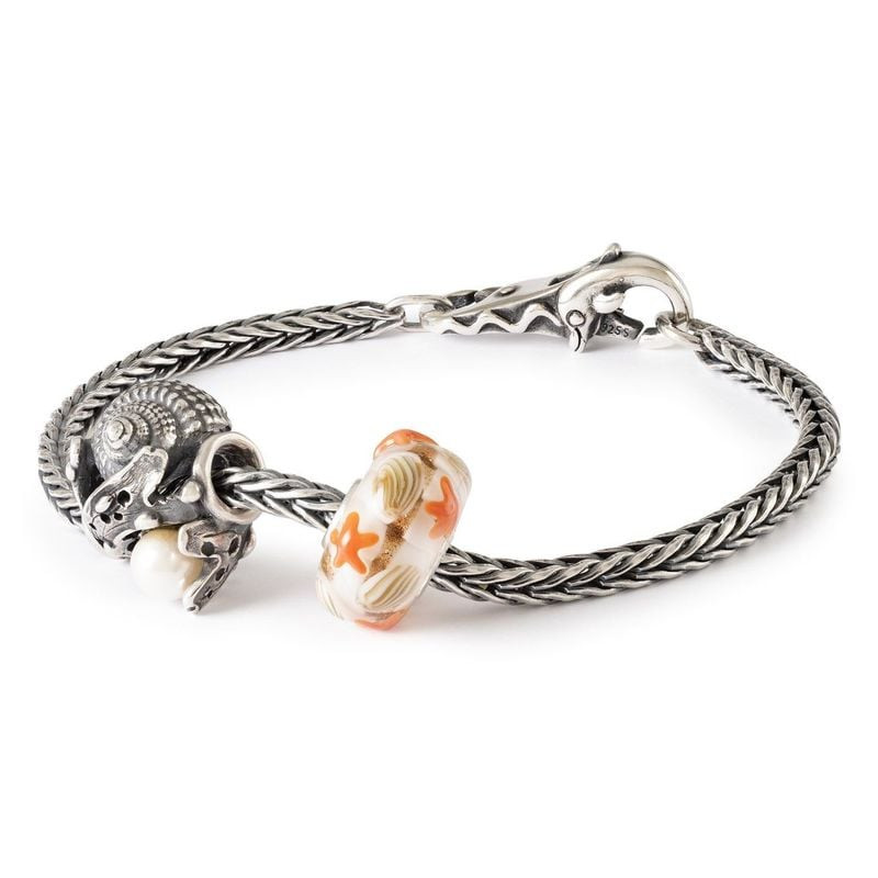 Bracelet Trollbeads en argent massif avec la perle de verre Guidé par les Vagues et une breloque coq