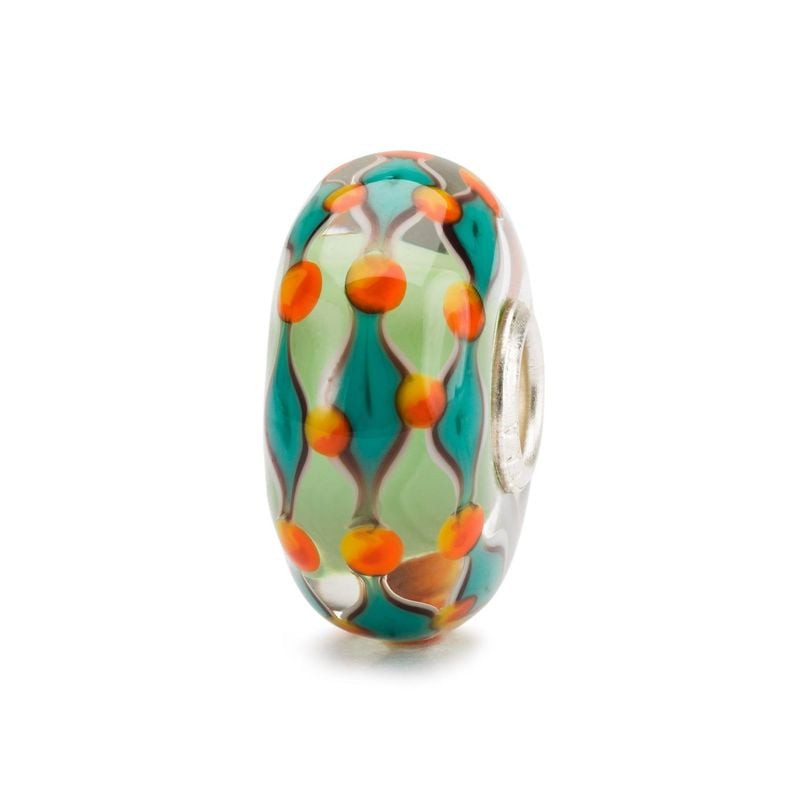 Perle en verre Trollbeads Champ Vert vue de biais, cœur vert pâle avec motif de points turquoise et 