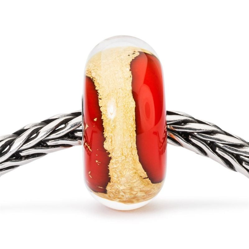Bille Trollbeads Chakra Racine enfilée sur un bracelet Trollbeads en argent tressé