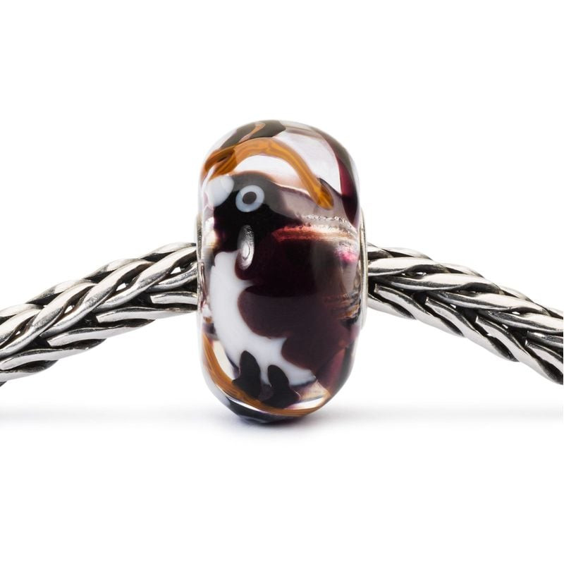 Perle Trollbeads Série Tombée de la nuit en verre avec oiseau, montée sur bracelet argent tressé
