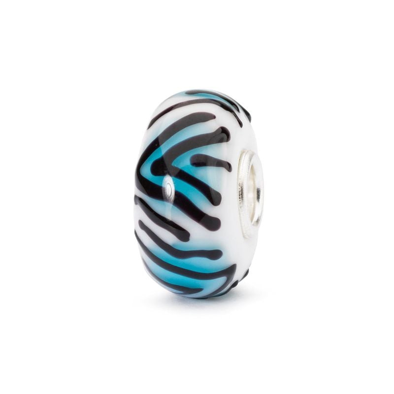 Perle en verre Trollbeads Tigre de topaze avec rayures noires sur verre turquoise et blanc, révélant