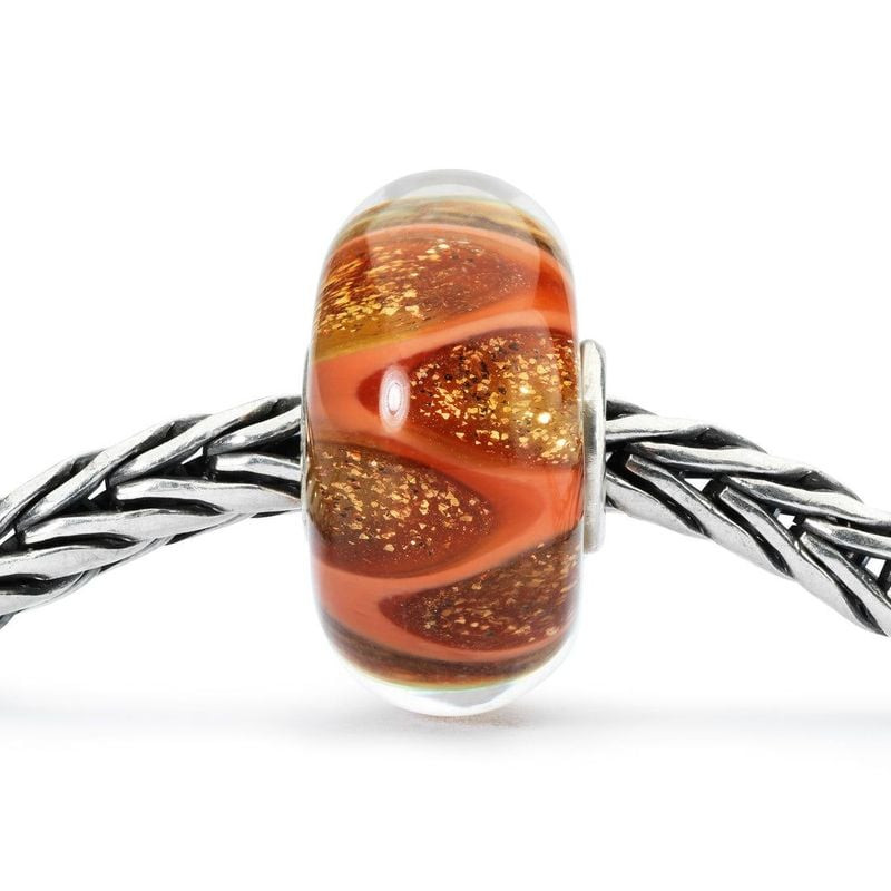 Packshot de la Perle Trollbeads Rires et amour Verre Doré, perle en verre soufflé à la main avec pai