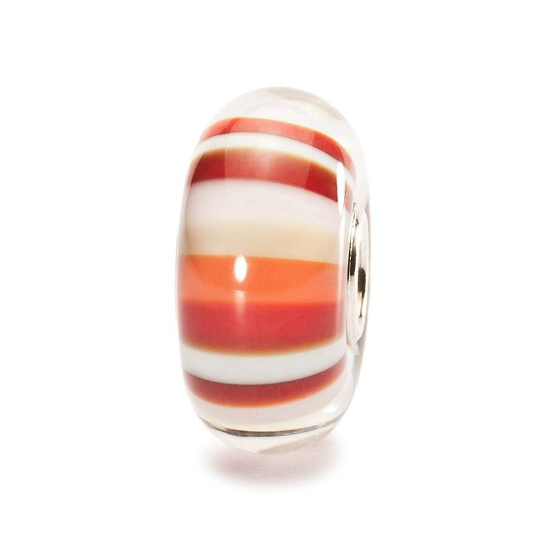 Perle en verre Trollbeads Framboise acidulée à rayures rouge, orange, rose et blanche sur fond blanc