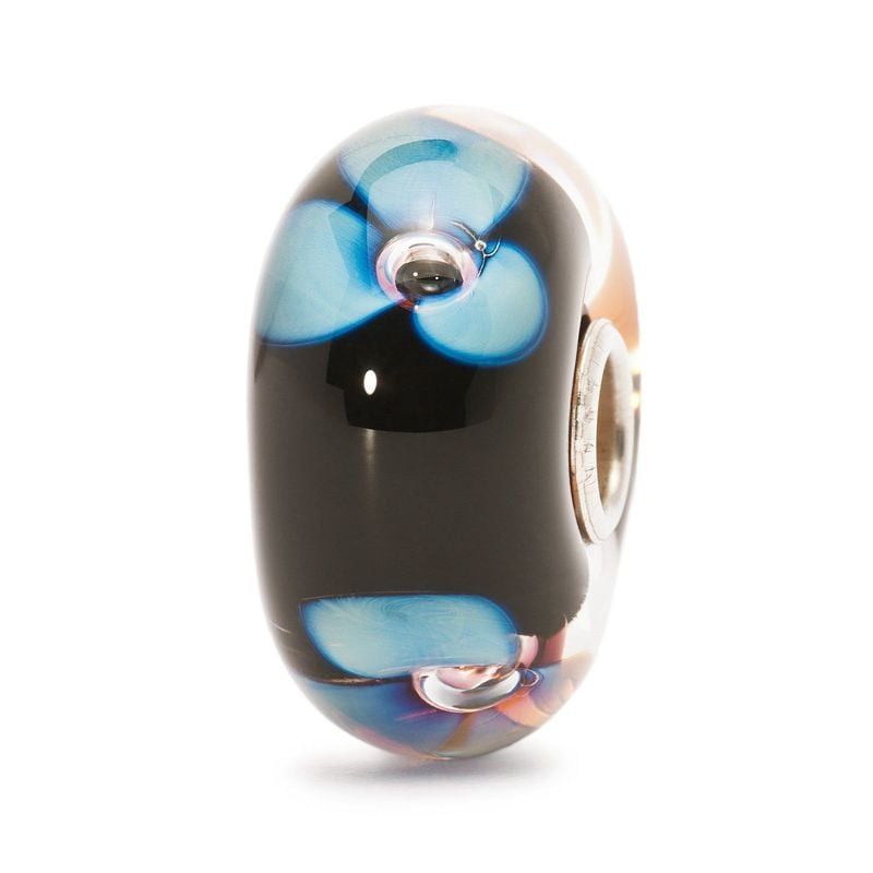 Perle Trollbeads Fleur de l'aurore en verre de Murano, fleur bleue sur fond noir et cœur en argent, 