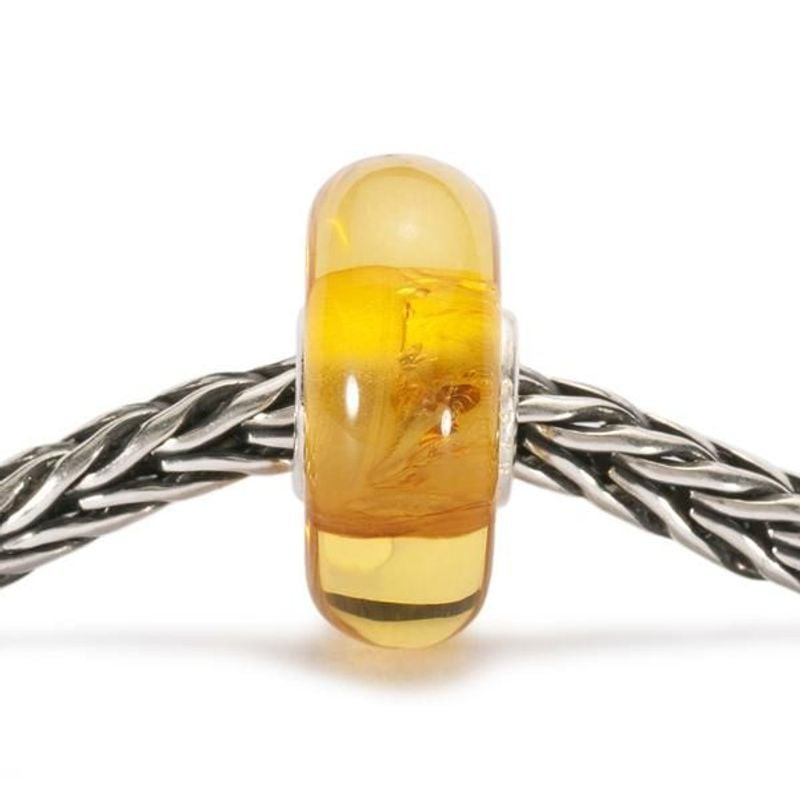 Perle Trollbeads Sirop d'érable Ambre Doré en ambre naturel, ambiance chaleureuse et dorée