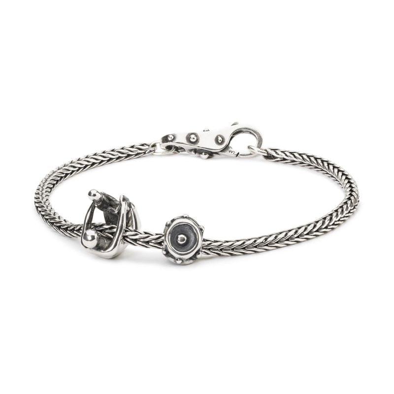 Bracelet à chaîne en argent Trollbeads avec la perle Paternité et une perle argent décorative.