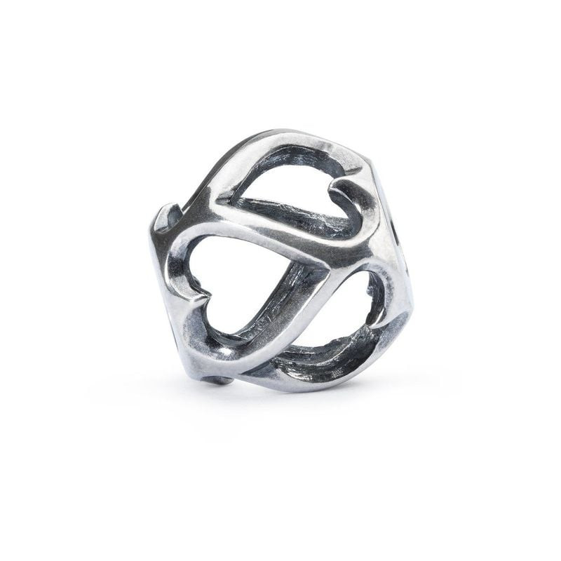 Perle Trollbeads Les opposés s’attirent en argent 925, cœurs opposés ajourés sur fond blanc