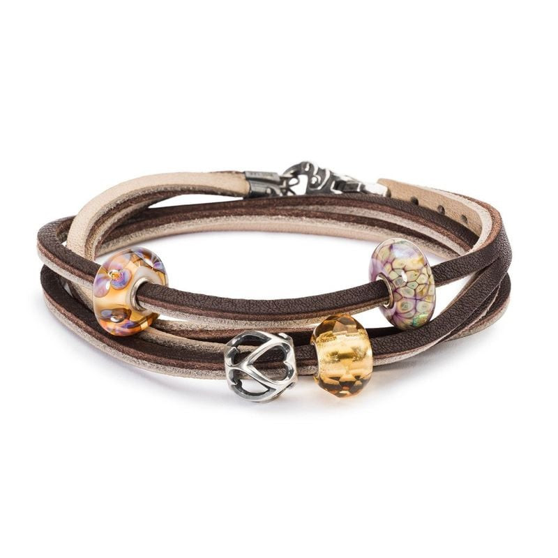 Perle de charme Trollbeads Les opposés s'attirent en argent sur bracelet en cuir marron avec des per