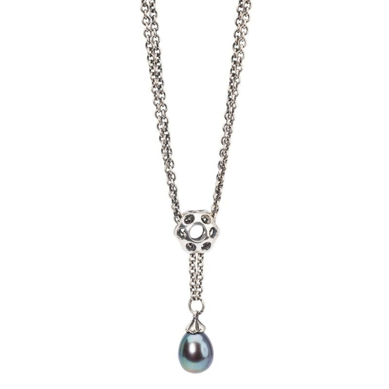 Perle de charme Trollbeads Flaques Argenté sur bracelet, reflets argentés, ambiance poétique.