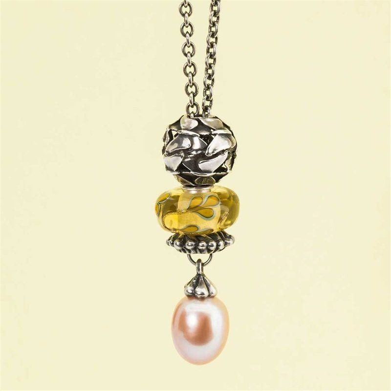 Charm Trollbeads Vision de Lumière Argenté en argent 925 sur fond lumineux
