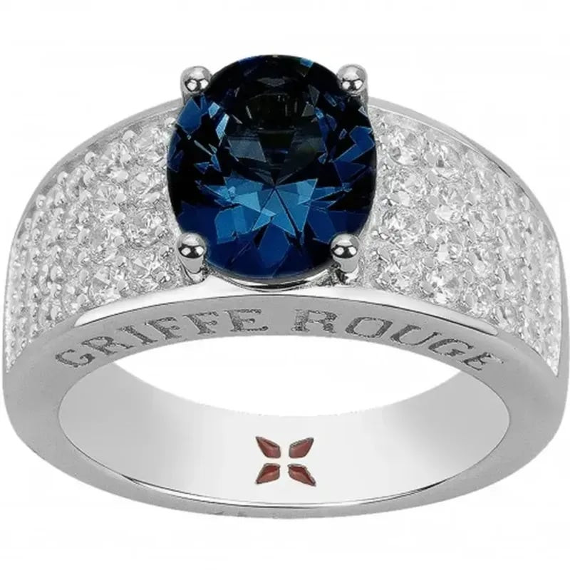 Bague Griffe Rouge en argent avec spinelle bleu synthétique ovale et oxydes de zirconium sertis.