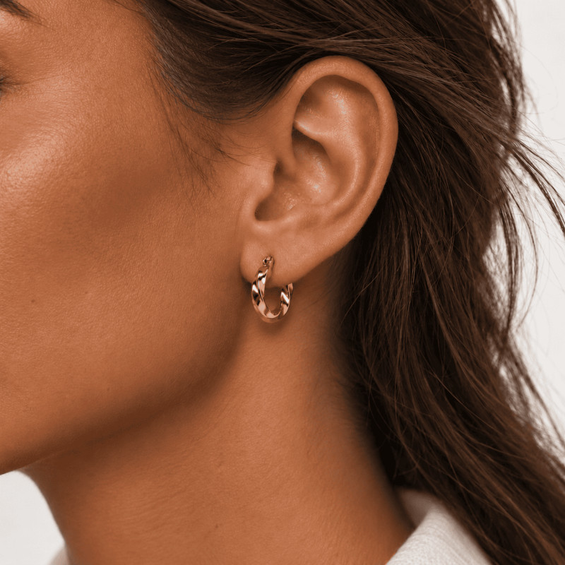 Boucles d'oreilles Créoles torsadées Amporelle en acier doré